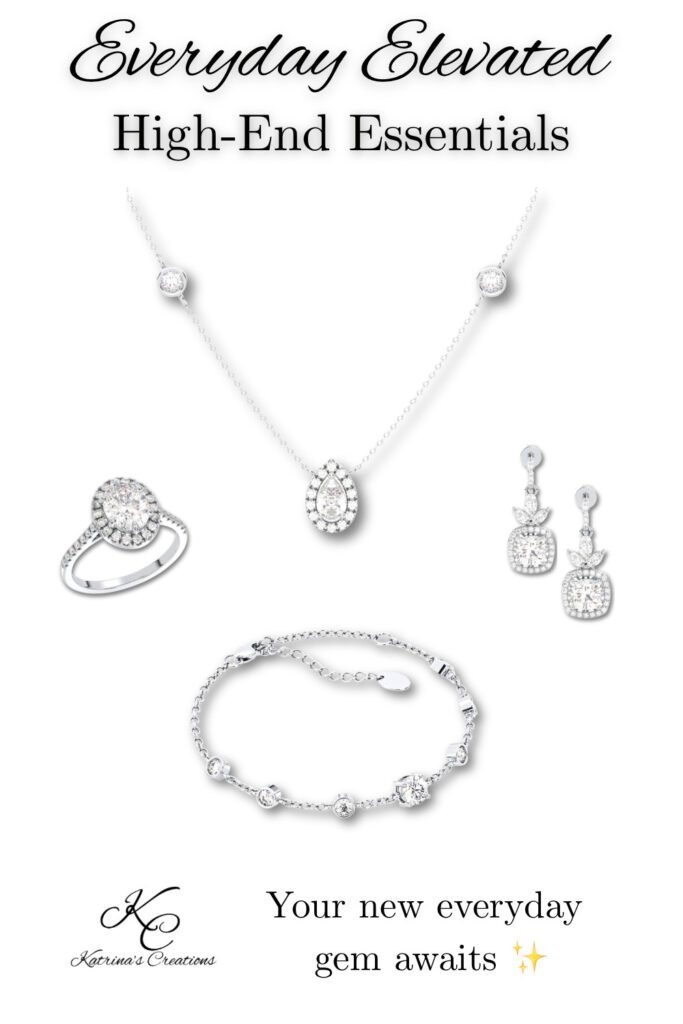 Silver high-end jewelry set featuring a delicate pendant necklace, coordinating drop earrings, statement ring, and matching bracelet displayed on a neutral background.
