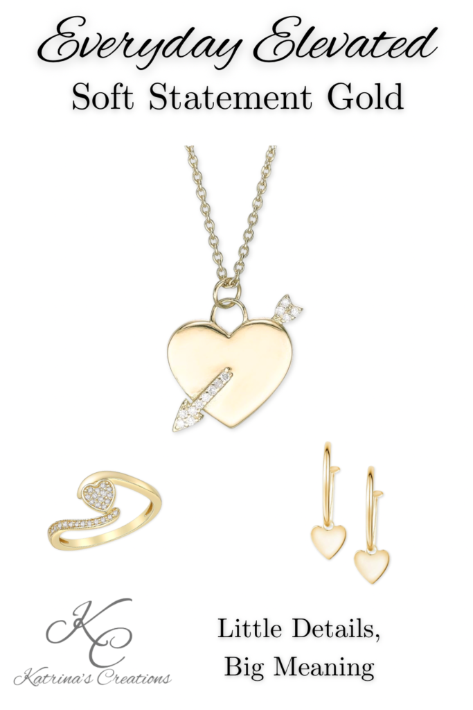 Gold heart jewelry set featuring a statement heart pendant necklace with arrow detail, coordinating heart hoop earrings, and a matching open-heart ring displayed on a neutral background.
