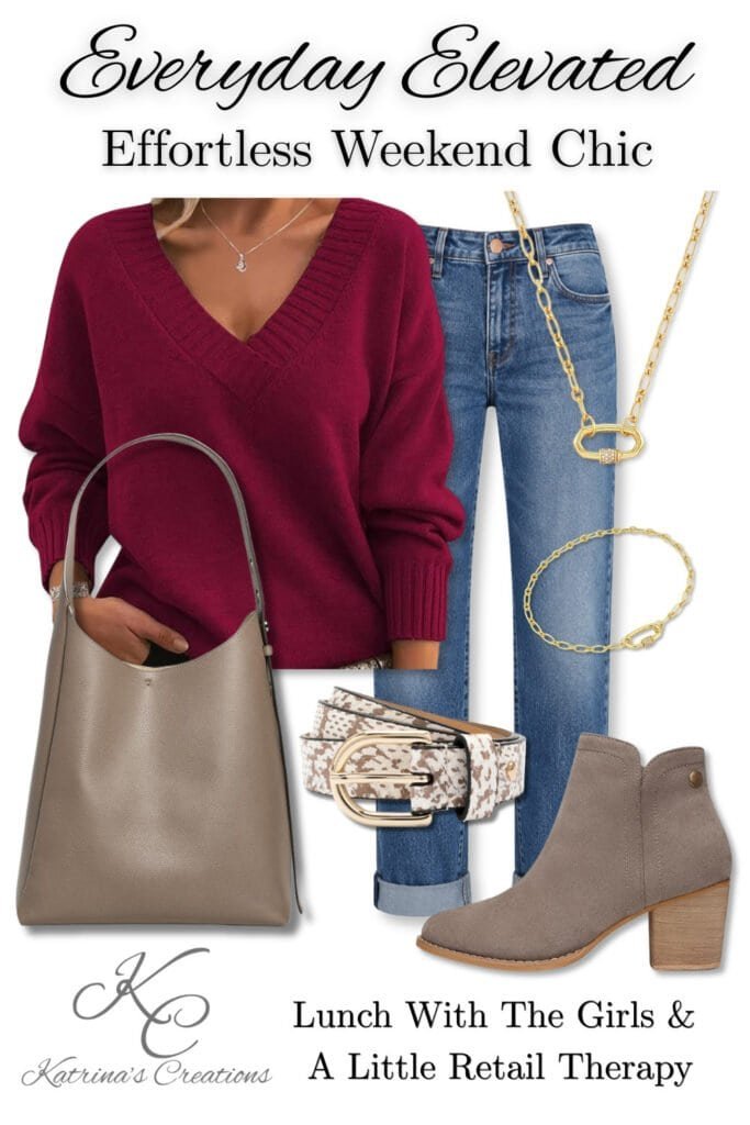 Woman wearing a berry v-neck sweater styled with cuffed blue jeans, taupe ankle boots, a neutral tote bag, gold jewelry, and a patterned belt for a casual weekend outfit perfect for lunch with friends and shopping.